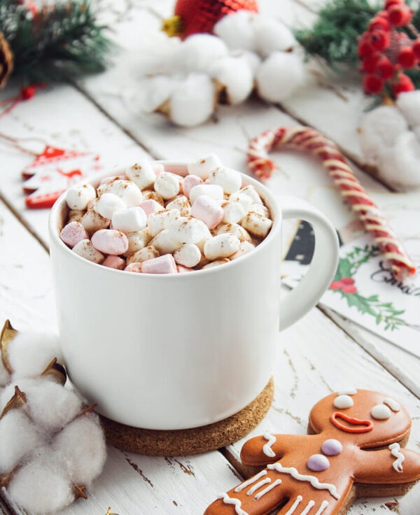 Frosty's favorite flavored coffee in a mug topped with marshmallows and cinnamon sprinkles