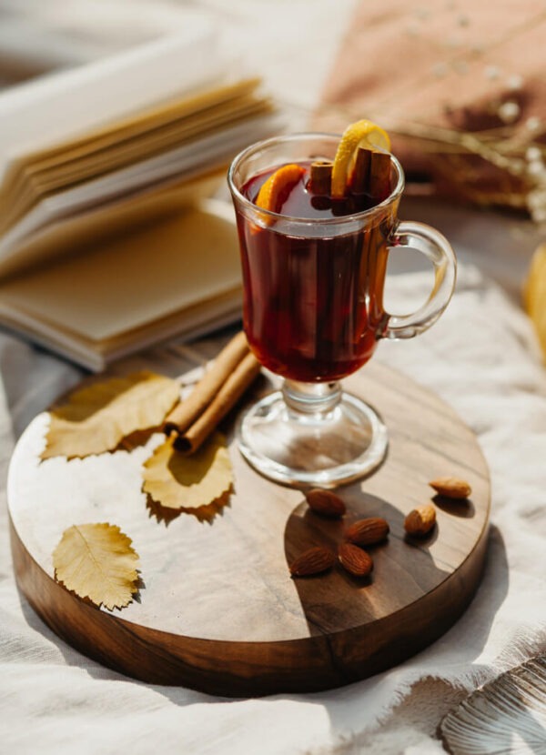 Orange Seville flavored coffee in a glass mug with an orange slice as garnish