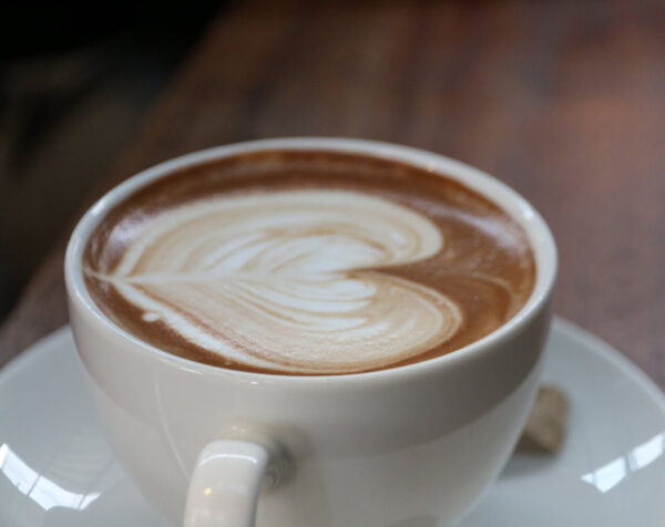 Mocha Java blend coffee in a coffee cup with heart art in foam on top